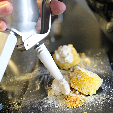 Cream whipper dispensing cream